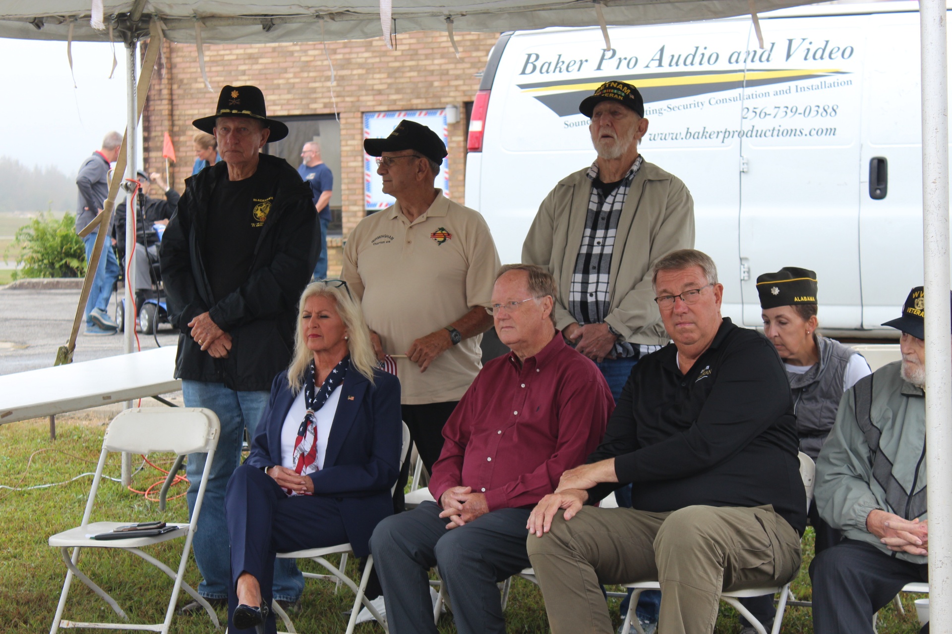 Dignitaries and Vietnam veterans seated during the invocation