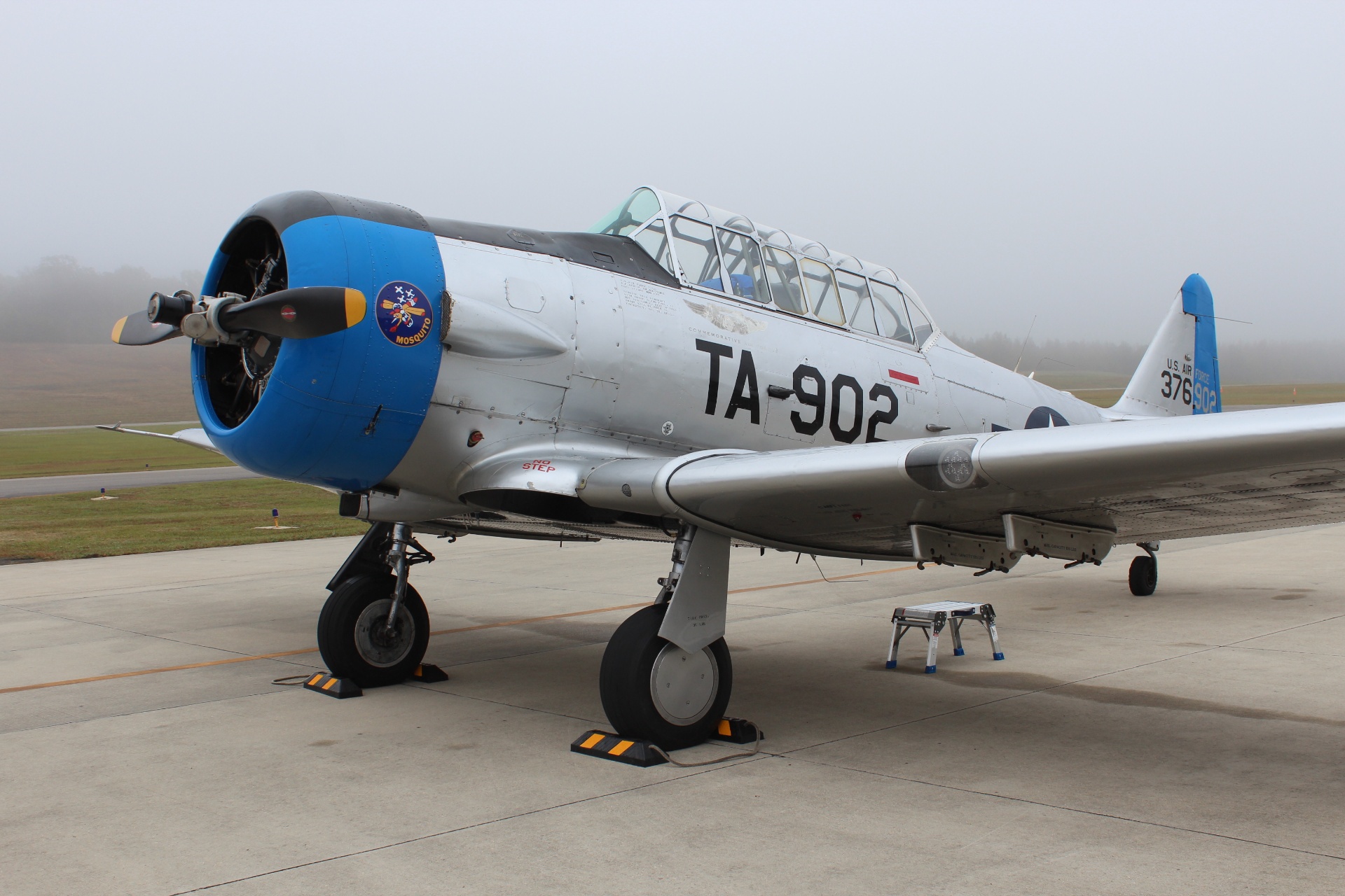 T-6 'Mosquito' trainer TA-902 on a misty flight line