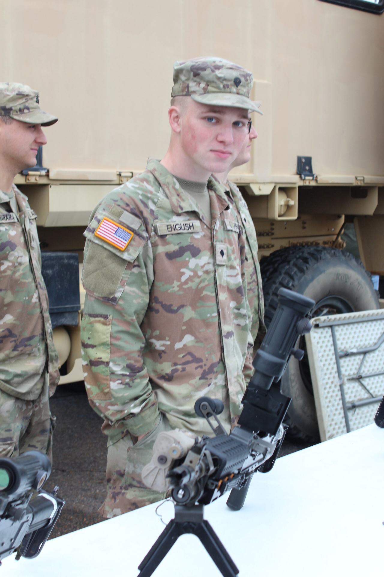 Alabama National Guard soldier at the weapons familiarization table