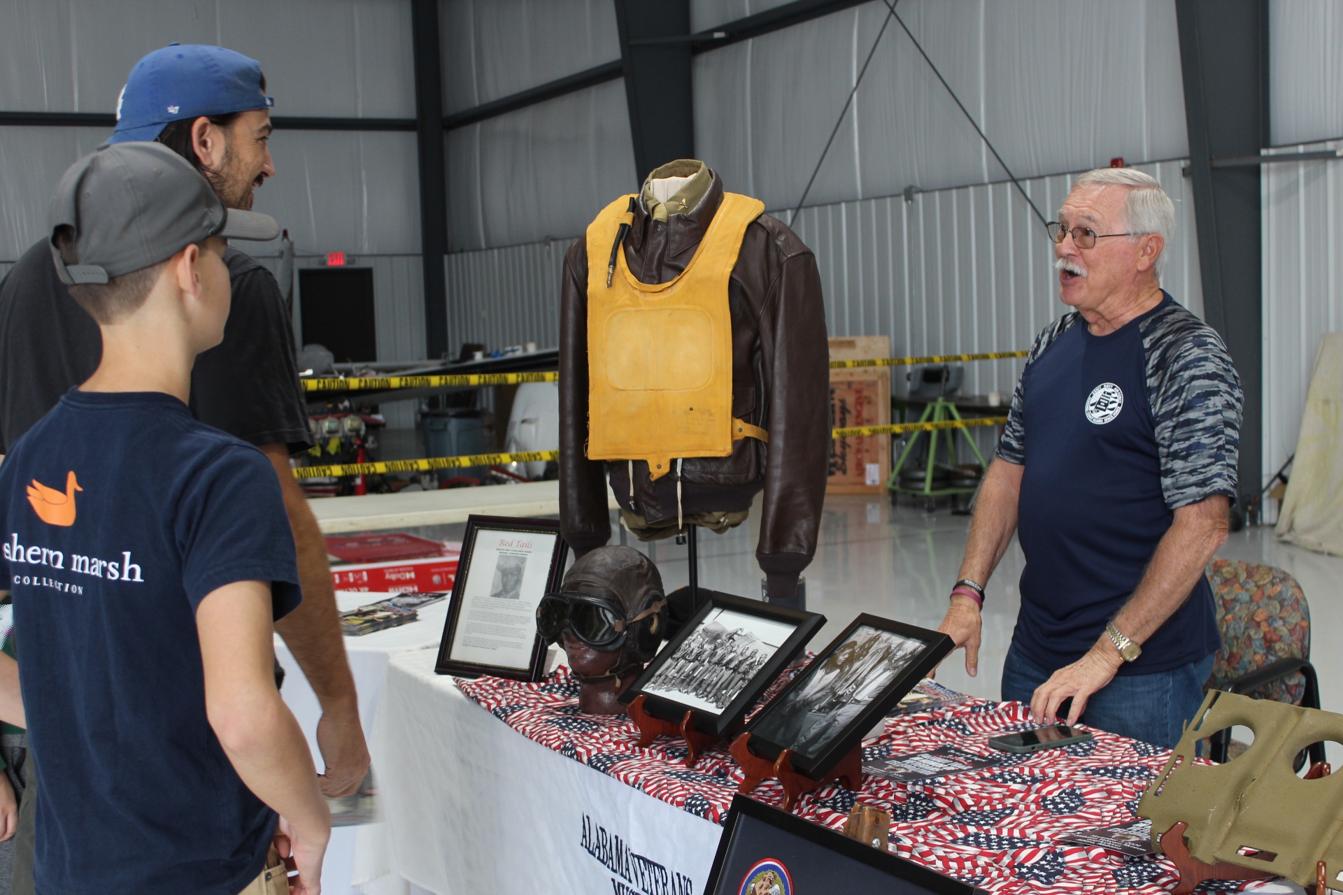 Alabama Veterans Museum volunteers share the Red Tails leather jacket display